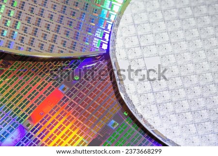 A pattern of microprocessor circuits on a silicon wafer. The semiconductors or central processing unit CPU microchips are fabricated from a silicon wafer with patterned layers of various materials.