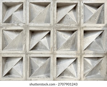 Pattern of molded clay or ceramic latticework, called Roster or breeze blocks, in geometric diagonal and triangular pattern. Roster is usually used as secondary skin of wall finishes in architecture.