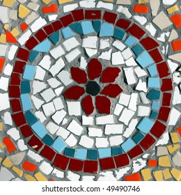  Pattern Of A Mosaic In The Form Of A Circle On A Street Wall . Bright, Decorative And Colorful Tiles And Splinters. Old Tel Aviv, Israel