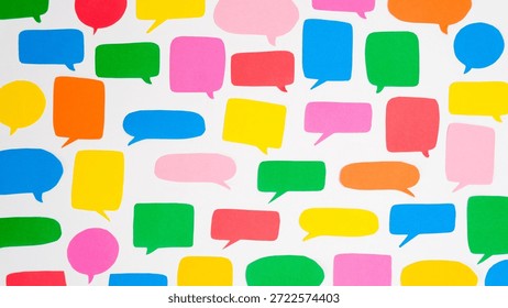 Pattern of multi-colored speech bubbles on a white background. Communication and social connections concept