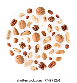 Pattern of nuts in circle form. Various nuts isolated on white. pecan, macadamia, brazil nut, walnut, almonds, hazelnuts, pistachios, cashews, peanuts, pine nuts. Top view or flat-lay. Copy space - Shutterstock ID 774991261