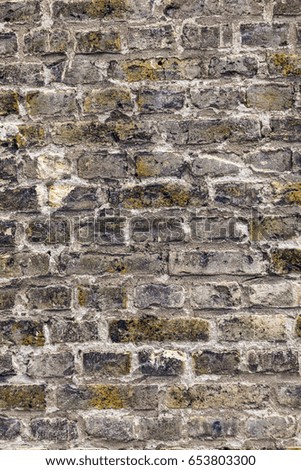pattern of an old brick wall of a abandoned factory building