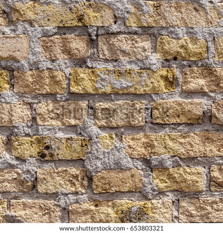 pattern of an old brick wall of a abandoned factory building