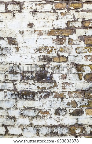 pattern of an old brick wall of a abandoned factory building