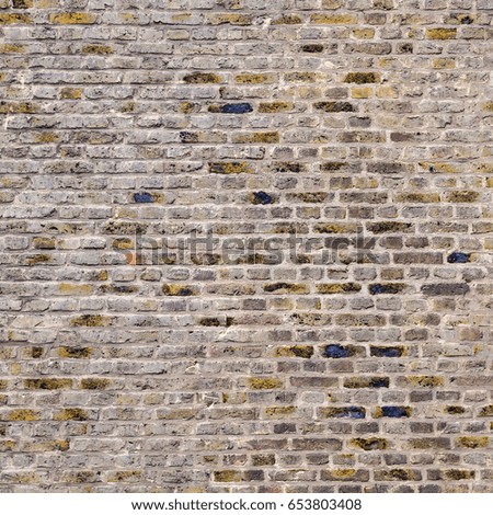pattern of an old brick wall of a abandoned factory building
