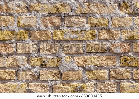 pattern of an old brick wall of a abandoned factory building