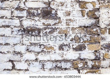 pattern of an old brick wall of a abandoned factory building