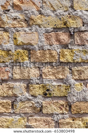 pattern of an old brick wall of a abandoned factory building