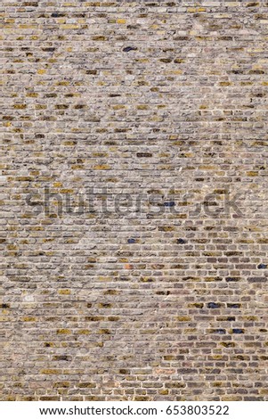 pattern of an old brick wall of a abandoned factory building