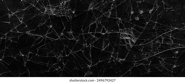 Pattern on cracked glass. damage to glass. broken or damaged background on glass wall