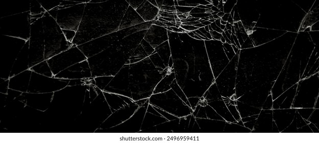 Pattern on cracked glass. damage to glass. broken or damaged background on glass wall