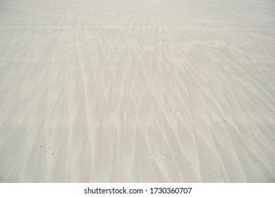Pattern on the white sand formed by sea water. Doc let beach in Vietnam