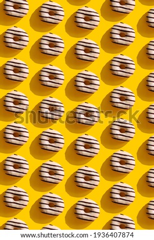 a pattern on a yellow background of donuts