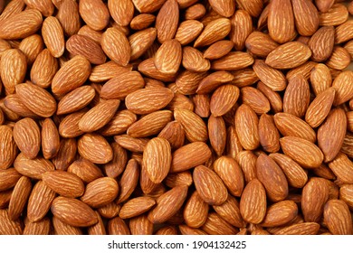 Pattern Organic almond nut raw peeled as background, top view. Healthy snack or for vegetarians. copy space banner.
