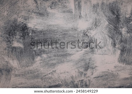 The pattern of the painted wall with silver and gray paint with beautiful strokes. Grunge abstract paint smudges.