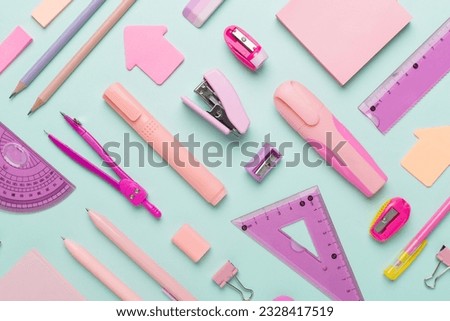 Pattern with pink school stationery on color backgroung, top view