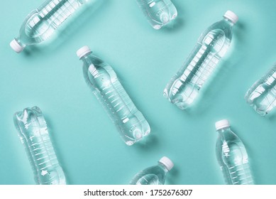 Pattern Of Plastic Bottles With Water On Blue Background. Top View. World Water Day. Copy Space. Banner. Pollution, Environmental Protection Concept. Global Water Crisis. World Water Problems.