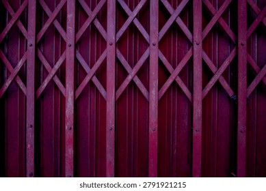 The pattern of the red iron gate.