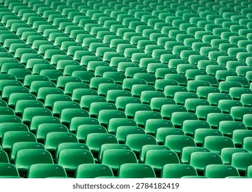 pattern Rows of empty green auditorium seats.