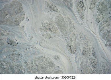 Pattern Of Silt And Mud Flow In Dirty Stream In Alaska.