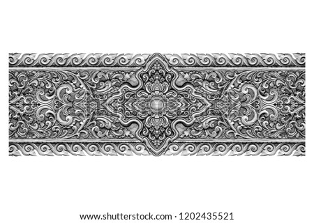Pattern of silver metal plate with flower carved on white background