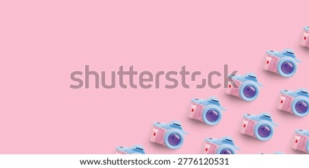 Pattern with SLR camera on pastel color background