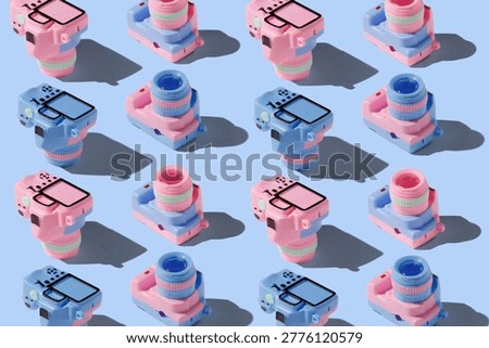 Pattern with SLR camera on pastel color background
