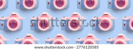 Pattern with SLR camera on pastel color background