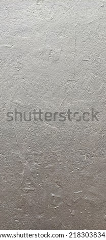pattern texture of a concrete surface painted in metallic gray