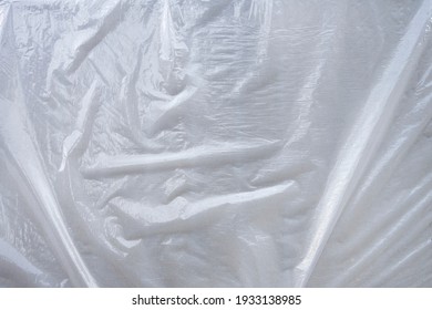 Pattern Textured White Grey Plastic Sheet Covering Over A Flat Surface With Wrinkles