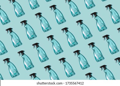 Pattern of transparent plastic bottle of cleaning product, household window cleaning liquid on blue background. Creative design for packaging. Top view. Flat lay. Detergent bottle.