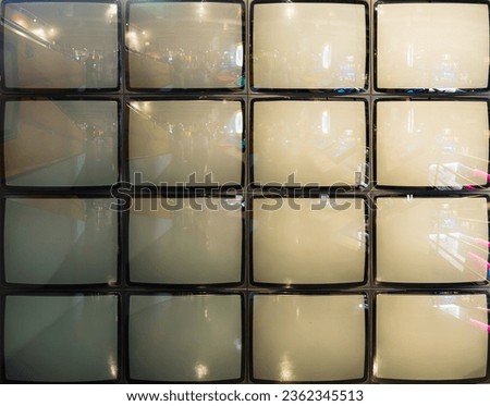 Pattern wall of pile black and white retro television (TV)