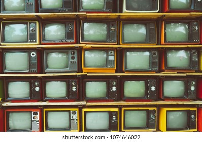 Pattern wall of pile vintage television (TV) - vintage filter effect style. retro technology.