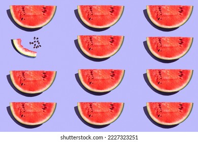 pattern from watermelon on a purple background. fruits on a purple table. juicy ripe watermelon on the dining table. fruit pattern - Powered by Shutterstock