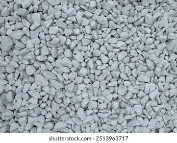 Pattern of white gravel with a uniform, clean texture. Сlose-up view of small, smooth gravel stones arranged in a seamless, repeating design. Ideal for backgrounds, surfaces, and abstract designs. - Powered by Shutterstock