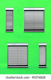 pattern of windows with red wall