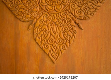 Pattern of wood carving art. The Thai art and craft texture on wooden background.  Thai-definition carved on wood to display in front of black wall background.Patterns represent national identity. on 