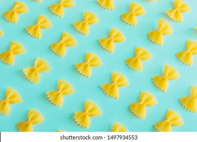 Pattern Of Yellow Pasta Bow On Blue Background. Italian Food. 