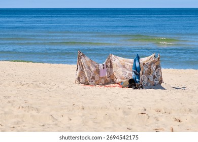 Patterned beach windscreen on sandy Baltic Sea beach