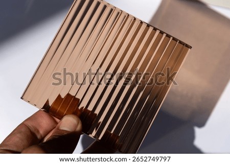 Patterned glass on white background.