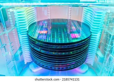 patterned silicon wafers in a universal pod. Electronic circuit designs have been built onto the wafers using micromaching including photolithography - Shutterstock ID 2185741131