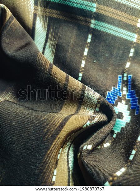 Patterned traditional woven fabrics -\
Textiles are flexible materials made from woven\
threads.