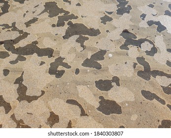 Patterns obtained from the reflection of sand from the surface of the water at the bottom of the puddle