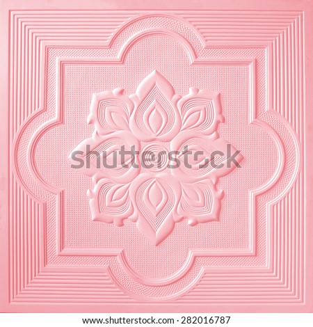 Patterns on the ceiling gypsum sheets of white flowers.