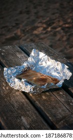 Patty Unwrapped On A Picnic Table