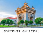 Patuxay a large clock tower in a city square in Laos