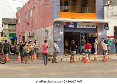 Paudalho, Pernambuco/Brazil - April 27 2020: Queue Of People In Front Of The Caixa Econômica Bank Waiting For The Emergency Aid That The Government Gave Due To The Covid 19 (coronavirus) Pandemic