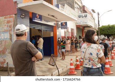 Paudalho, Pernambuco/Brazil - April 27 2020: Queue Of People In Front Of The Caixa Econômica Bank Waiting For The Emergency Aid That The Government Gave Due To The Covid 19 (coronavirus) Pandemic