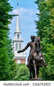 Paul Revere statue with the Old North Church steeple in the background.