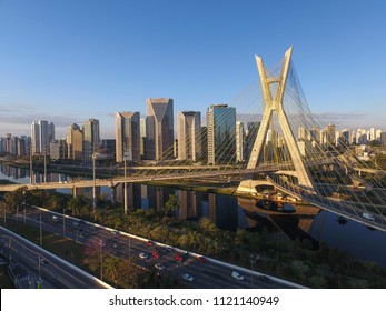 São Paulo, São Paulo / Brazil - 06/23/2018: Aerial view of the Octavio Frias de Oliveira Bridge - the cable-stayed bridge is a landmark of São Paulo, Marginal Pinheiros Avenue, Pinheiros River